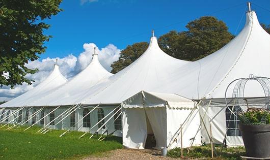 a line of sleek and modern porta potties ready for use at an upscale corporate event in Somerset